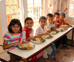 Girls at ISN eat breakfast.