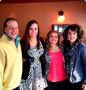 Peyton's dad, her sister, Peyton, and her mom are pictured smiling.