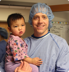 Levi with his father Ben, before his cleft palate surgery.