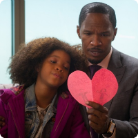 A picture of Mr. Stacks holding a paper heart with Annie.