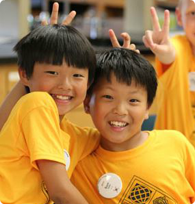 Campers give each other bunny ears at Minnesota's Korean Culture Camp
