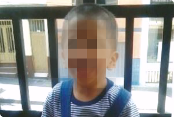 A blurred photo of B, a young boy waiting to be adopted in South America.