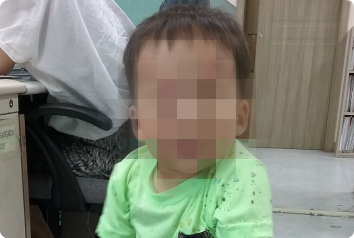 A blurred photo of JY, a toddler boy waiting for an adoptive family in Asia.