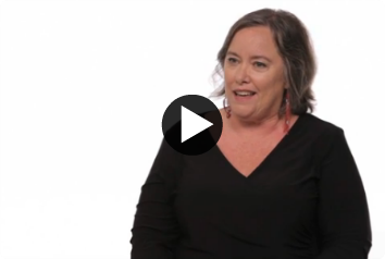 A screen shot of a video of Beth Hall sitting in front of a white background talking about white privilege and adoption.