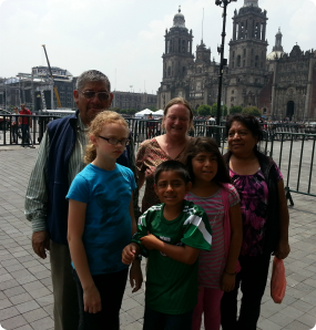 Daniela with her birth mother and adoptive family in Mexico.