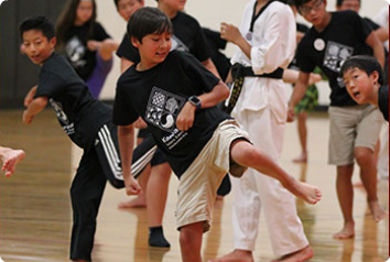 Kids doing TaeKwonDo at Korean Culture Camp in Minnesota.