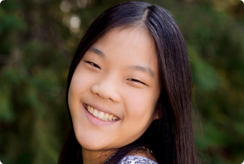 A picture of Grace, who wrote a poem about her identity as a Korean adoptee.