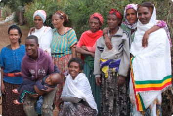 Pictured here is a group of Ethiopians smiling by a tree
