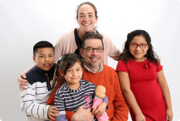 Kip and Amy are pictured with their three children who were adopted from Latin America.