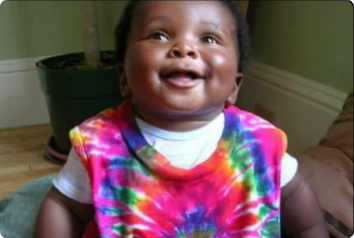 Catherine's son when he was around 1, wearing a tie-dye shirt.