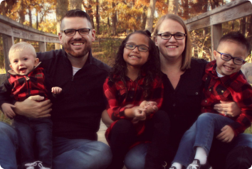 Jodi and Ted with their three children. Two were adopted and have Down Syndrome.