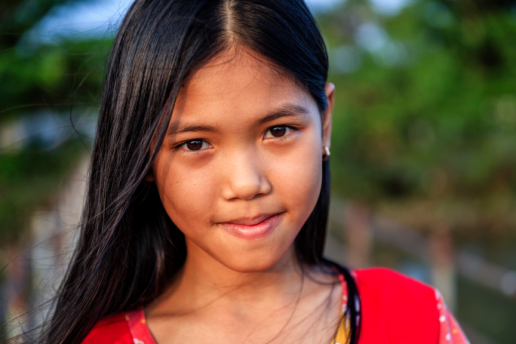 Portrait of Vietnamese girl in red shirt