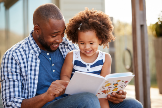 Father reading with daughter