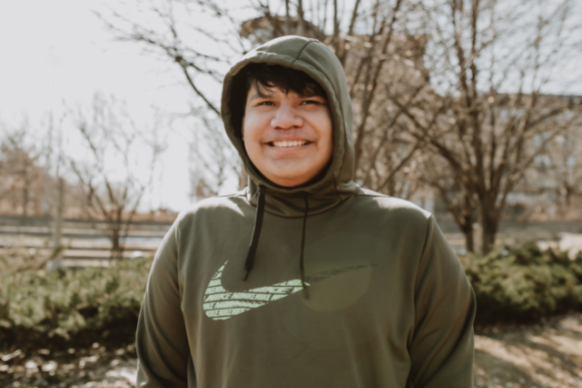 17-year-old boy smiles wearing Nike hoodie