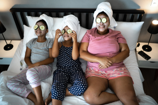 Mom and daughters with face masks, self-care