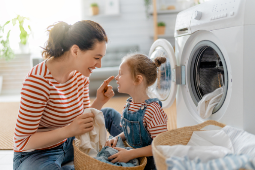 Mother and daughter do laundry together
