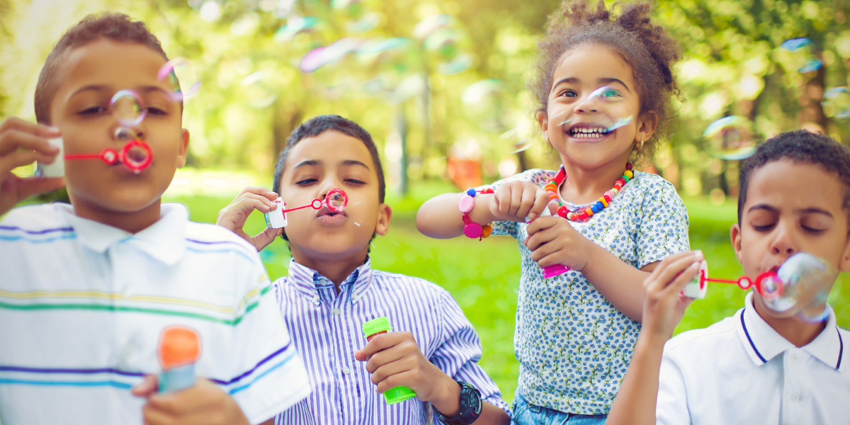 Children blowing bubbles