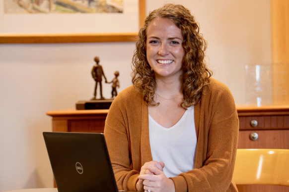 Lyla Ronchak, a child specific recruiter at Children's Home, sitting at her laptop