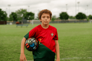 picture of Karlitos playing soccer, a boy in foster care waiting for his forever family