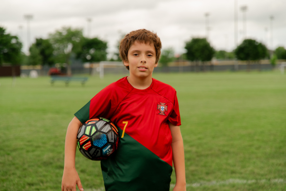 picture of Karlitos playing soccer, a boy in foster care waiting for his forever family