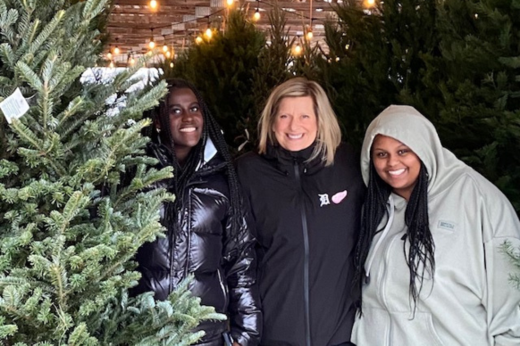 staff spotlight series Kim Gessert and her two daughters picking out a Christmas tree