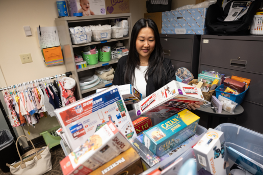 Child specific recruiter Colleen sorting through donations in the community closet