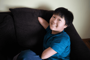 Jiangli sitting on the couch