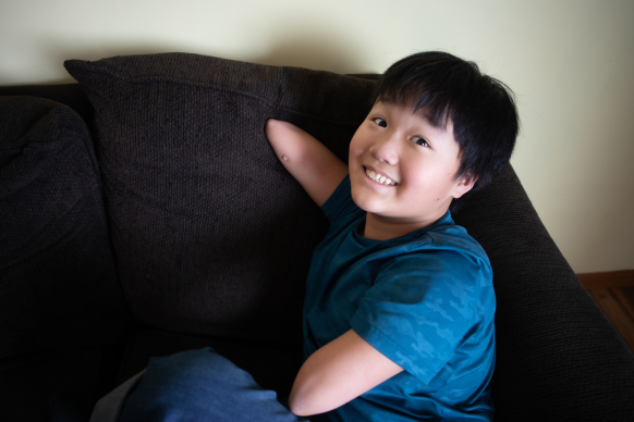 Jiangli sitting on the couch